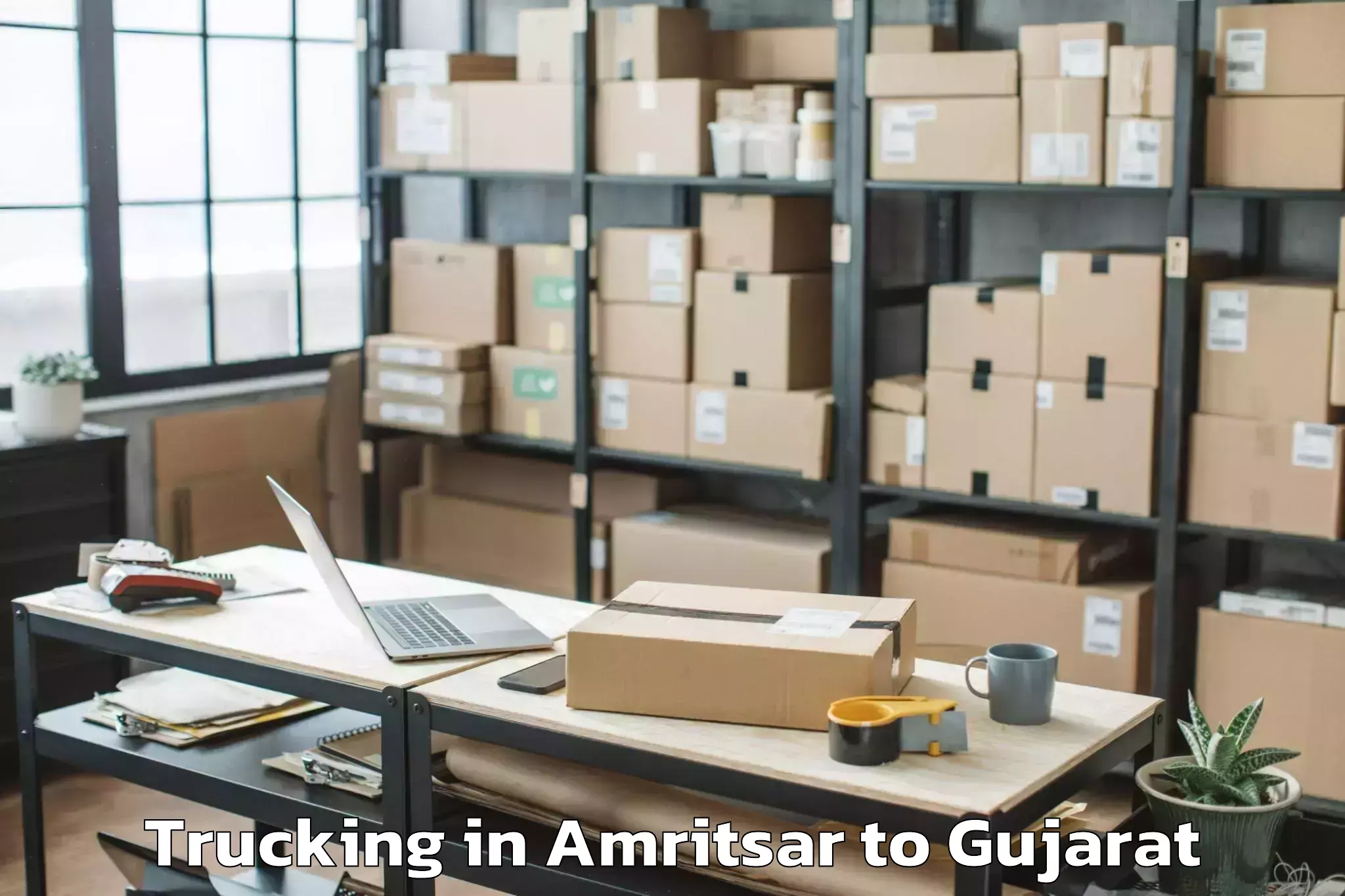 Top Amritsar to Gujarat Ayurved University Jam Trucking Available